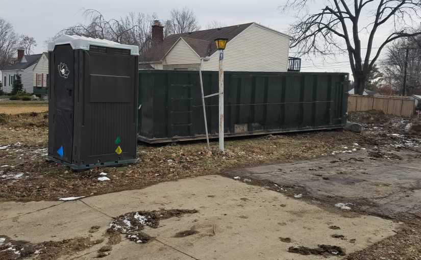 portable toilet and dumpster for home clean up