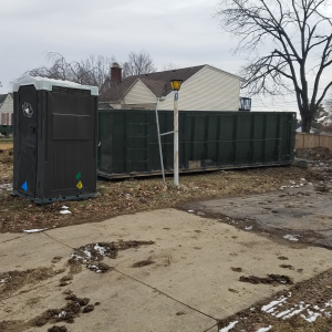 portable toilet and dumpster for home clean up